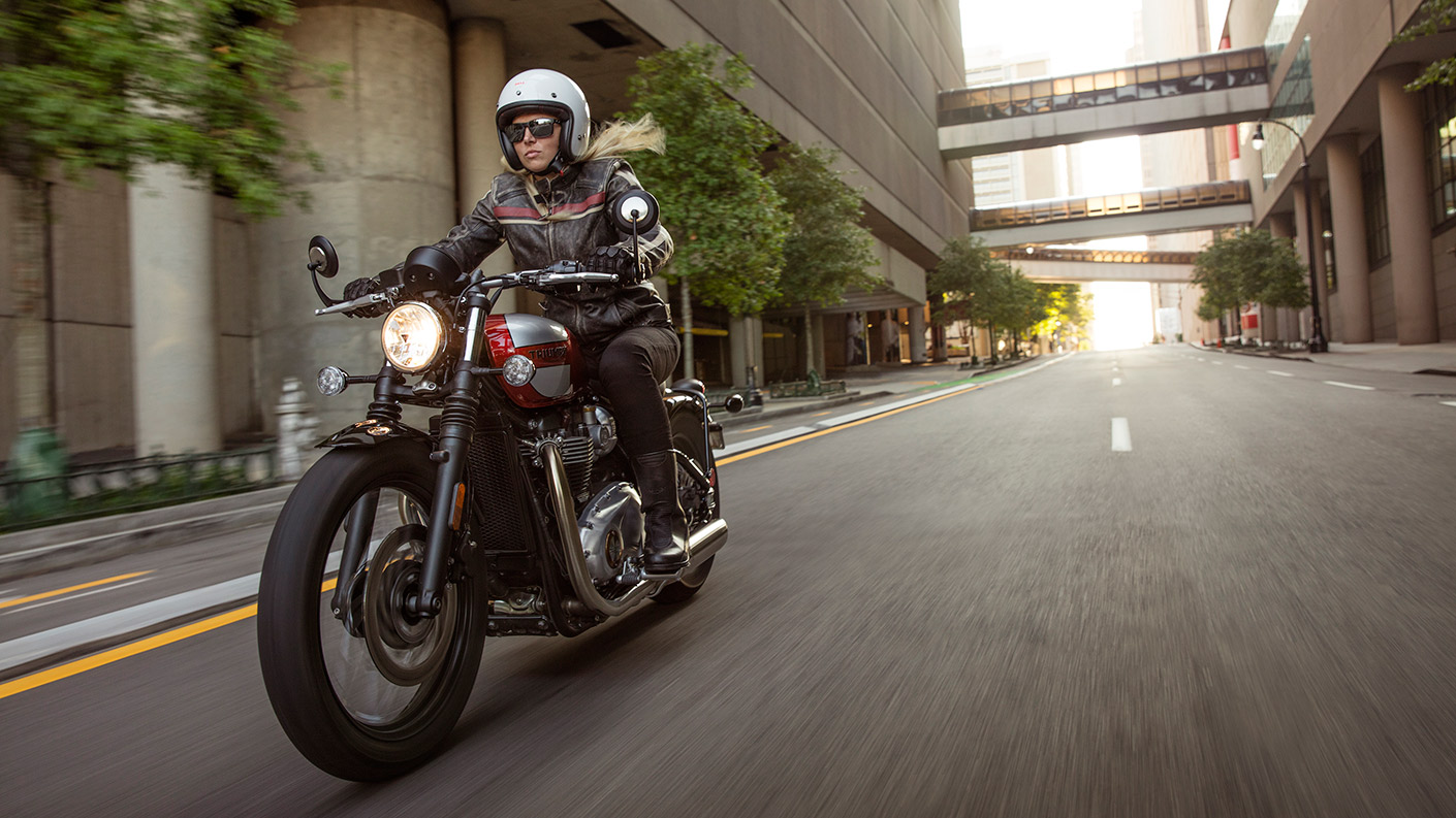 Person riding a Triumph Bonneville Bobber