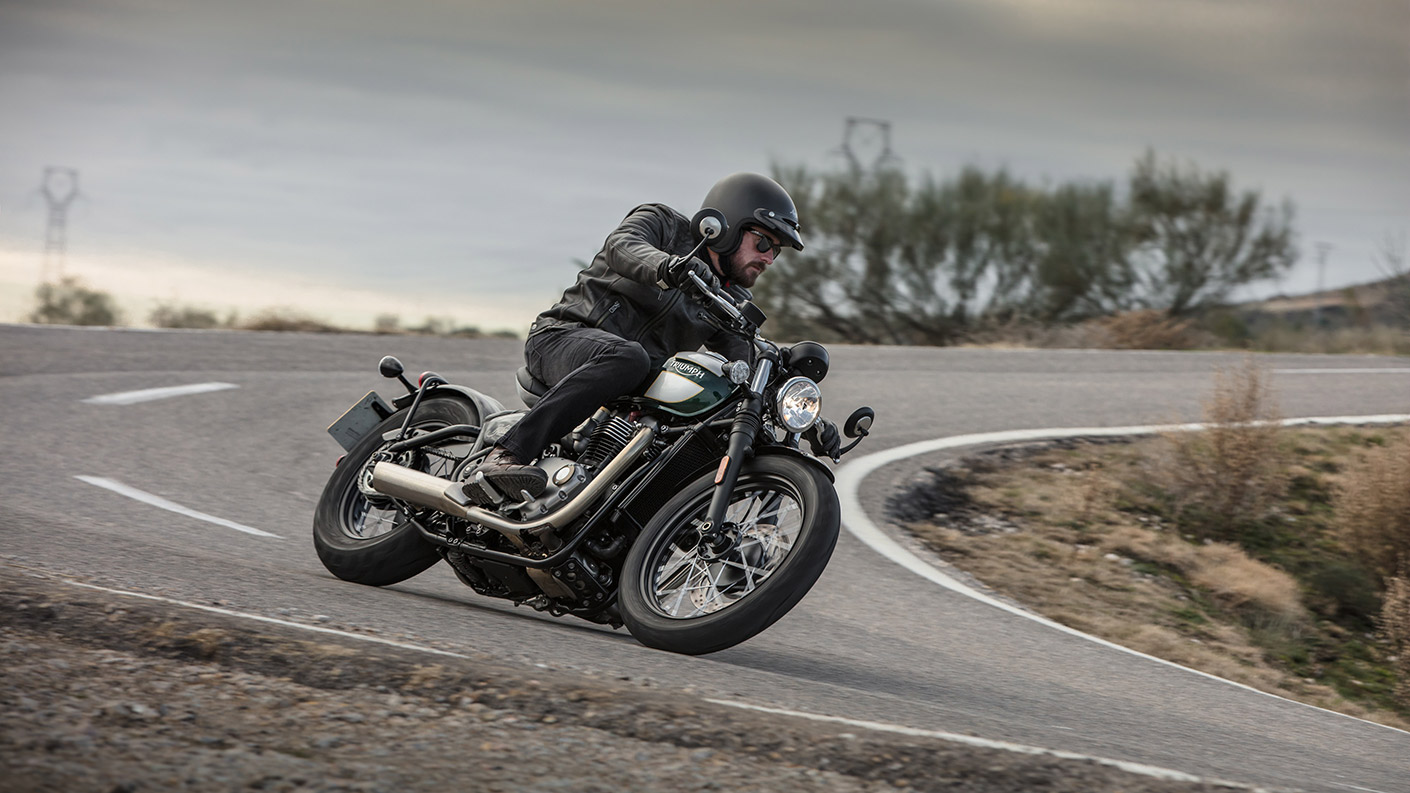 Person riding a Triumph Bonneville Bobber
