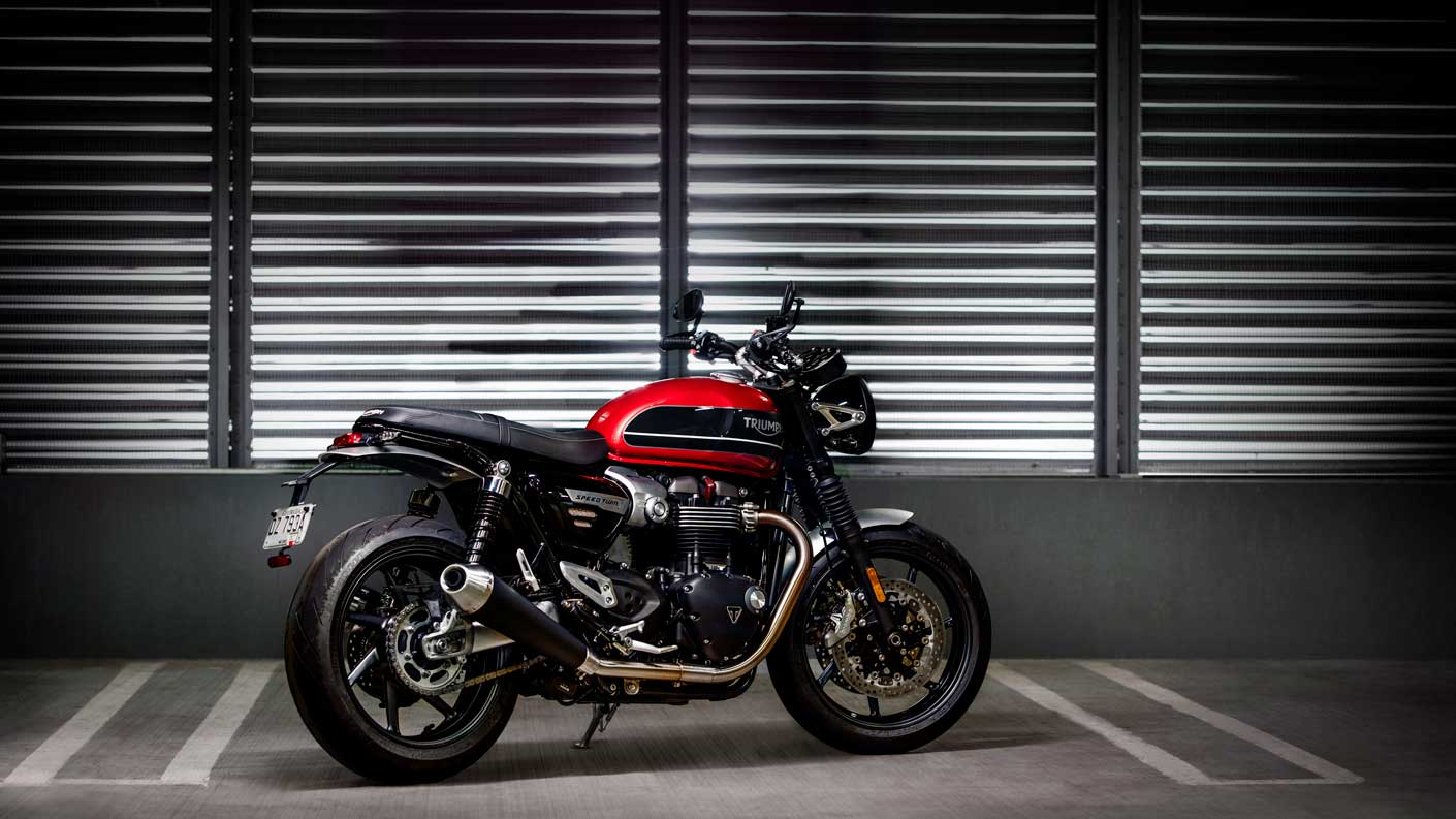 All-new Triumph Speed Twin in Korosi Red and Storm Grey parked in underground car park