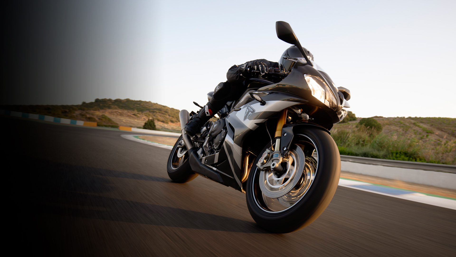 Triumph Daytona Moto2TM 765 motorcycle (EU and Asia Edition) racing around a race track in Spain